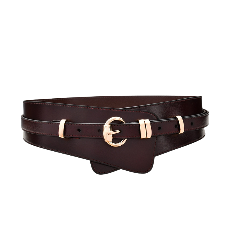 Ceinture femme Camélia en cuir bordeaux avec boucle dorée ronde, lanière fine et partie décorative large.