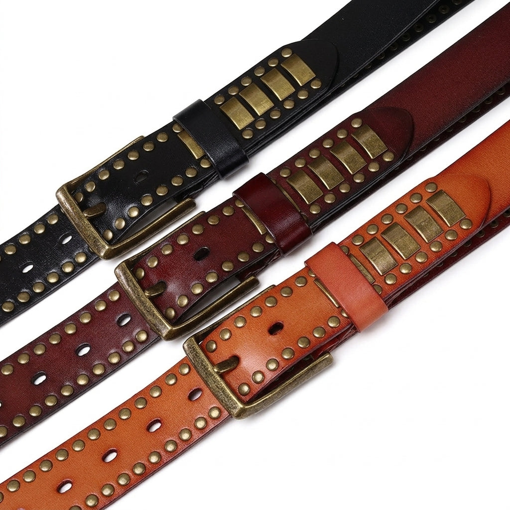Trois ceintures pour homme Carnac en cuir pleine fleur avec rivets métalliques et boucle ardillon, disponibles en noir, marron foncé et camel.