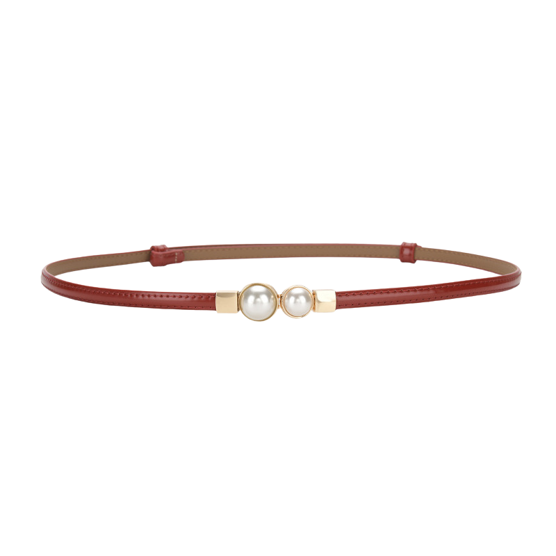 Ceinture fine rouge Chamonix pour femme avec deux perles nacrées et détails dorés, en cuir de vachette.