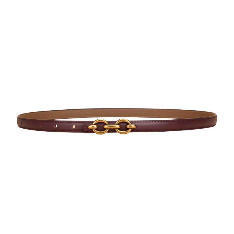 Ceinture fine Geneviève en cuir lisse bordeaux avec boucle dorée à deux anneaux ovales.