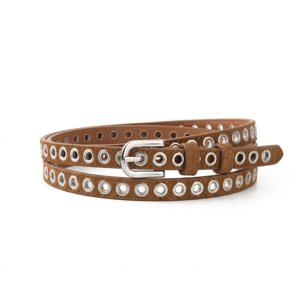 Ceinture fine pour femme Léonie en cuir marron avec œillets métalliques argentés et boucle ovale, accessoire au style minimaliste et rock