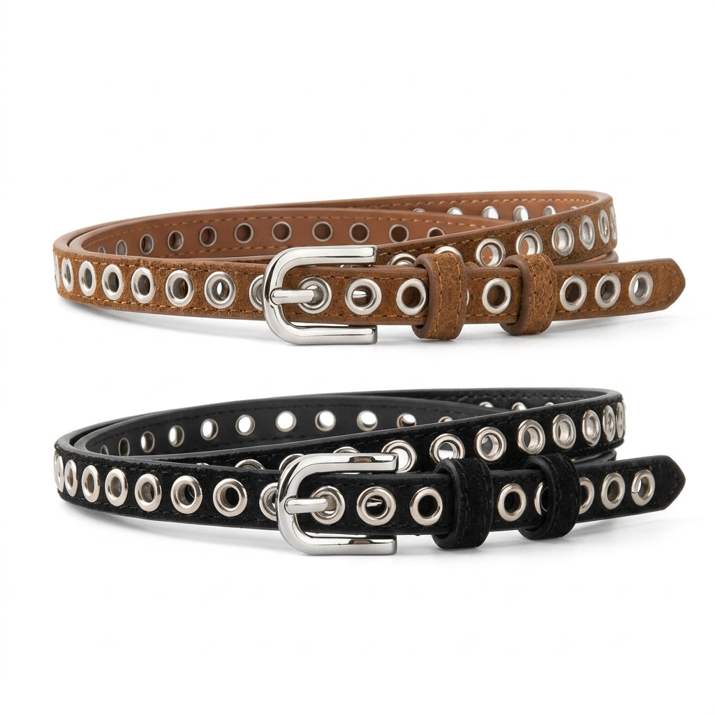 Deux ceintures fines femme Léonie en cuir, l'une marron et l'autre noire, avec œillets métalliques et boucle ardillon ovale argentée sur fond blanc.