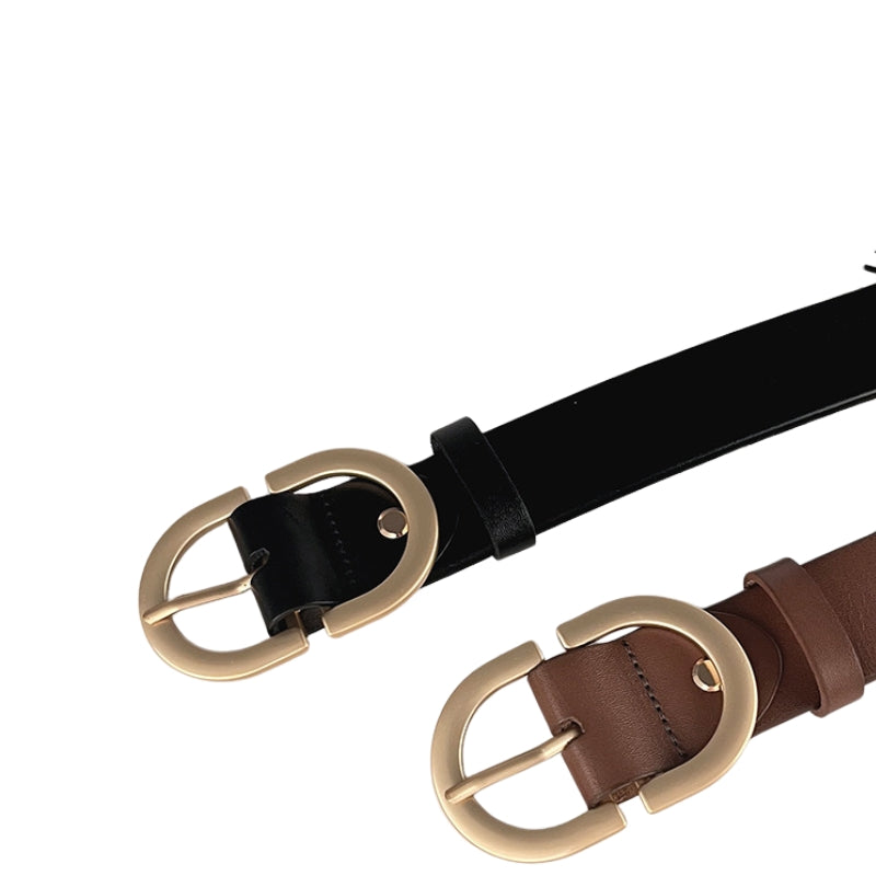 Ceinture Saphira noire et marron en cuir avec boucle ovale dorée, vue rapprochée sur le détail de la boucle et du cuir.