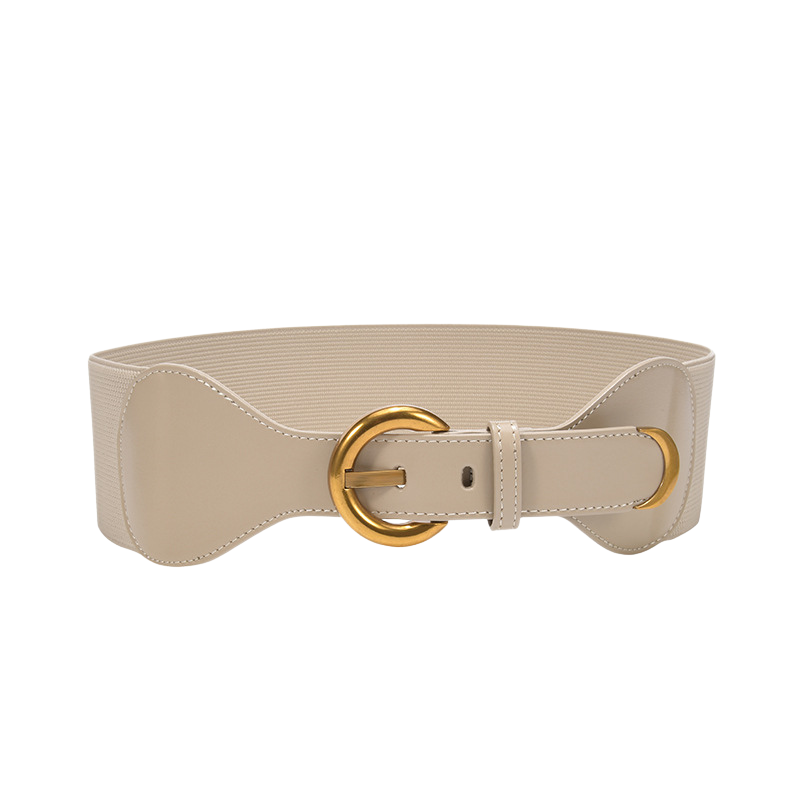 Ceinture femme Sybille beige en cuir verni et élastique tissé avec boucle dorée ronde. Accessoire élégant et confortable qui souligne la taille. Taille unique.