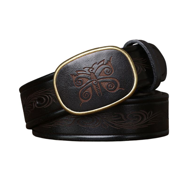 Ceinture pour homme Totem d’Acier noire en cuir gravé d'un motif ethnique de papillon sur la boucle ovale en cuivre doré vieilli et de volutes sur le cuir. #fullwidth