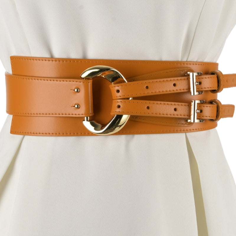 Ceinture corset large en similicuir orange avec boucle dorée et sangles ajustables.