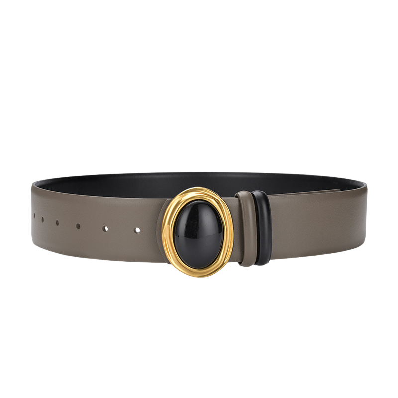 Ceinture femme Estelle en cuir gris avec boucle ovale dorée ornée d'une pierre noire.