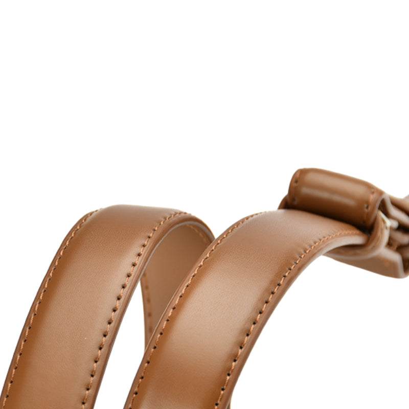 Ceinture fine en cuir refendu de vachette marron clair, modèle Iris, avec boucle ovale dorée.