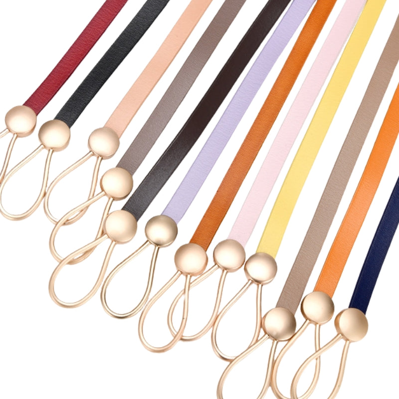 Ceintures fines Iseult avec boucles bijou dorées, présentées en plusieurs couleurs : rouge, noir, beige, gris, marron, lavande, orange, rose pâle, jaune, taupe, orange vif et bleu marine.