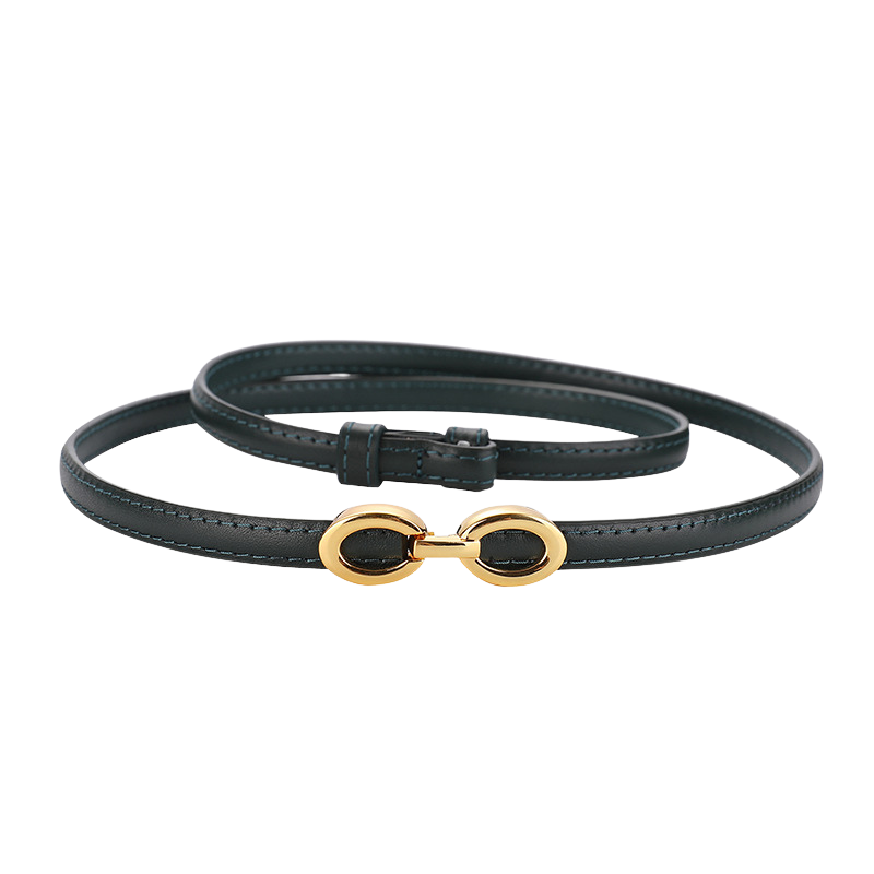 Ceinture fine Onirique en cuir vert avec boucle ovale dorée décorative.