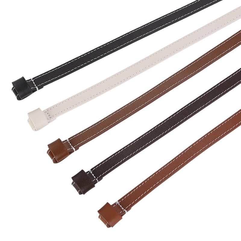 Ceinture Thalia fine en cuir pleine fleur, disponible en noir, blanc cassé, marron clair, marron foncé et brun, avec coutures blanches contrastantes et design à nouer sans boucle.