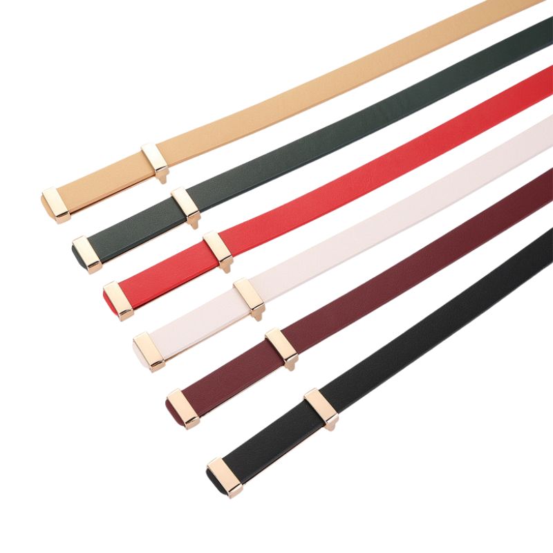Ceinture fine pour femme Whisper en cuir nubuck disponible en plusieurs couleurs : beige, vert sapin, rouge, blanc cassé, bordeaux et noir, avec boucle rectangle dorée.